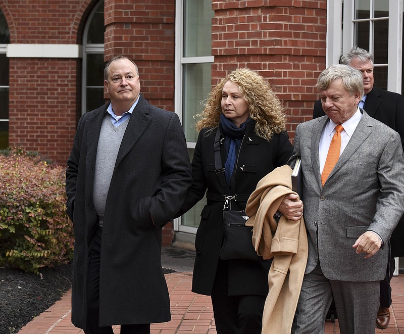 Former Pilot Flying J President Mark Hazelwood, left, leaves federal court after being arraigned Tuesday, Feb. 9, 2016, on charges including conspiracy to commit wire fraud and mail fraud as well as witness tampering. Seven other Pilot employees were also named in the 14-count indictment. Hazelwood faces an additional charge of witness tampering.