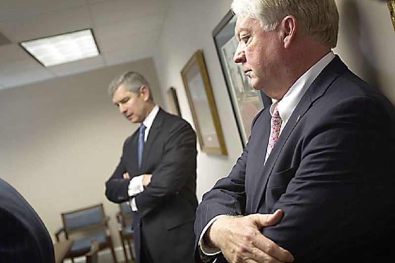 University of Georgia President Michael Adams, right, and Georgia Tech President G.P. "Bud" Peterson, left, listen during a news conference during a 2014 Georgia Board of Regents meeting. ( (AP Photo/David Goldman)