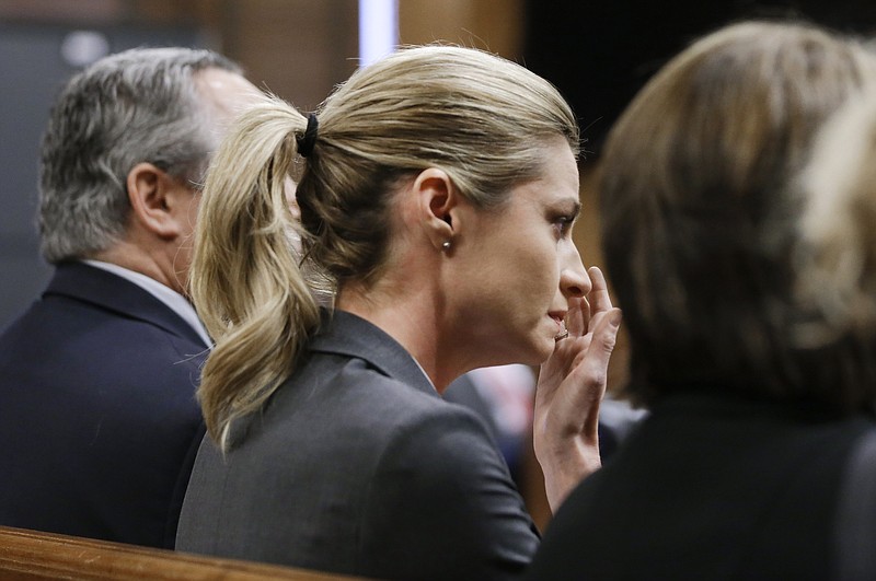 Sportscaster and television host Erin Andrews wipes tears as the verdict is read Monday, March 7, 2016, in Nashville. A jury has awarded Andrews $55 million in her lawsuit against a stalker who bought a hotel room next to her and secretly recorded a nude video, finding that the hotel companies and the stalker shared in the blame. 