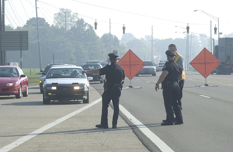 Chattanooga police direct traffic after a fatal accident on Amnicola Highway.