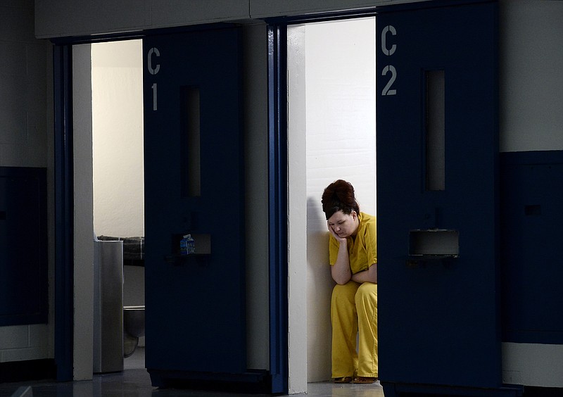 
              ADVANCE FOR USE SUNDAY, MARCH 13, 2016 AND THEREAFTER - In this Jan. 27, 2016 photo, Rachael Hamm sits in her cell at the Rutherford County Adult Detention Center in Murfreesboro, Tenn. Rutherford County courts are using a private probation company, which profits by collecting monthly probation fees and fees for drug-testing and other services. The county is being sued for using the private company because critics say it is not fair to trap those on probation in a cycle of debt. Hamm says she struggles to take care of her two children because of the probation fees she has to pay. (AP Photo/Mark Zaleski)
            