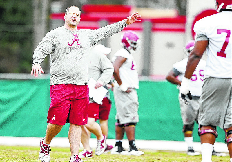 New Alabama offensive line coach Brent Key offers instructions during Friday's first spring workout in Tuscaloosa.