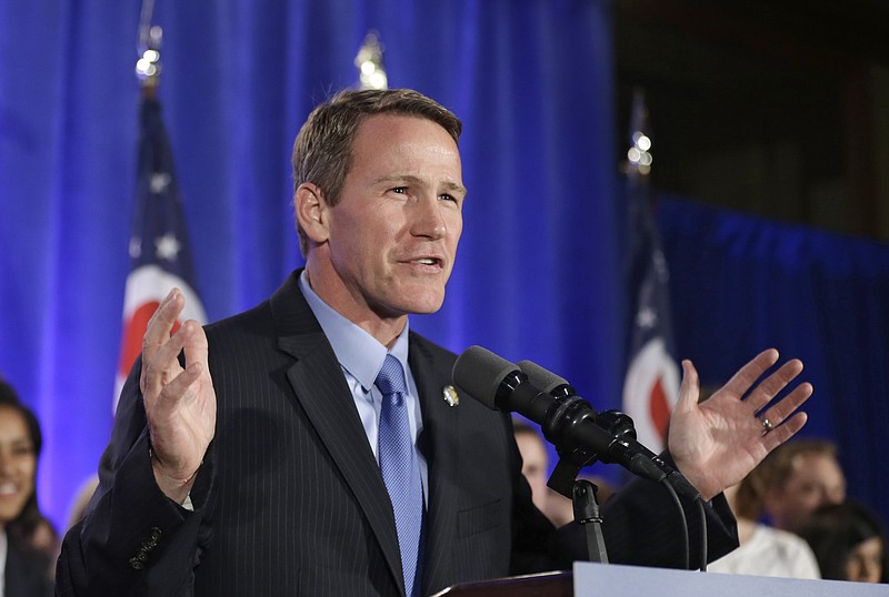 In this Nov. 4, 2014, file photo, Ohio Secretary of State Jon Husted speaks to supporters at an Ohio Republican Party celebration in Columbus, Ohio. A policy for Ohio's youngest voters is under dispute in the swing state, causing confusion and prompting two lawsuits days before the primary election. Ohio law allows 17-year-olds who will be 18 before the fall election to vote in next week's primary, with some exceptions. Young Ohio voters can decide on congressional, legislative and mayoral contenders but can't vote on tax levies, ballot issues or a political party's central committee candidates. 