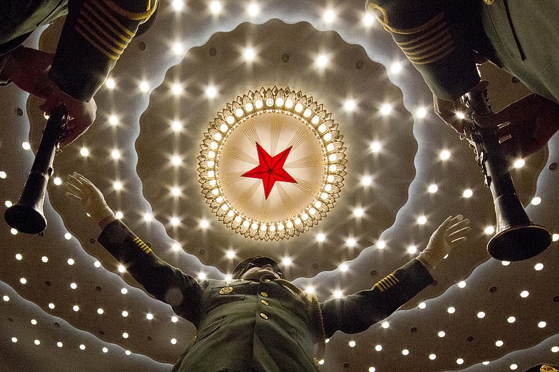 
              A conductor leads a military band at the opening session of the annual National People's Congress in Beijing's Great Hall of the People, Saturday, March 5, 2016. (AP Photo/Ng Han Guan)
            