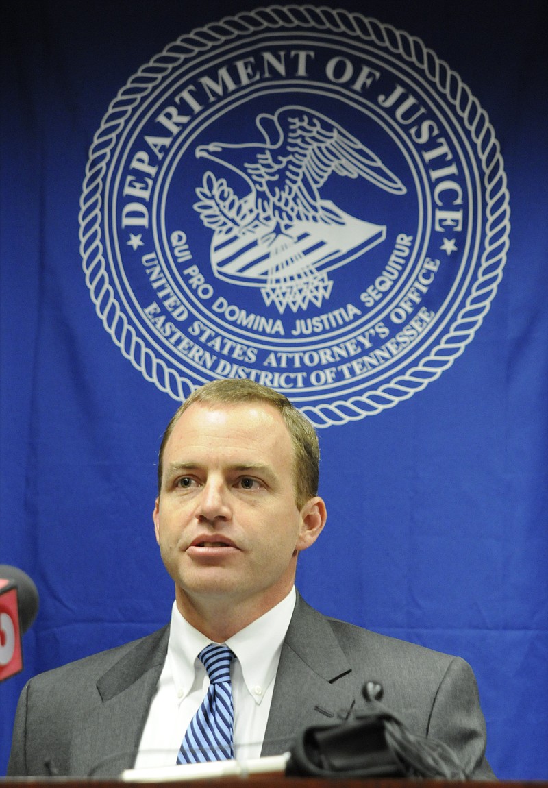 Assistant U.S. Attorney Chris Poole speaks at a 2013 press conference.