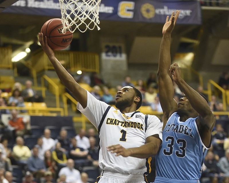 UTC's Greg Pryor shoots as Citadel's Quinton Marshall guards Monday, Feburary 1, 2016, at McKenzie Arena.