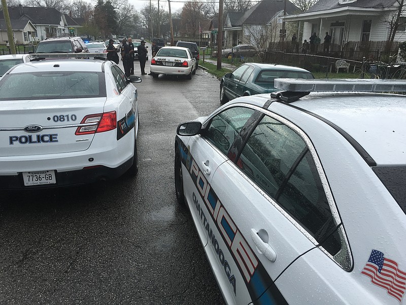Police officers respond to a shots fired call in the Oak Grove neighborhood off of Beech Street on Monday.