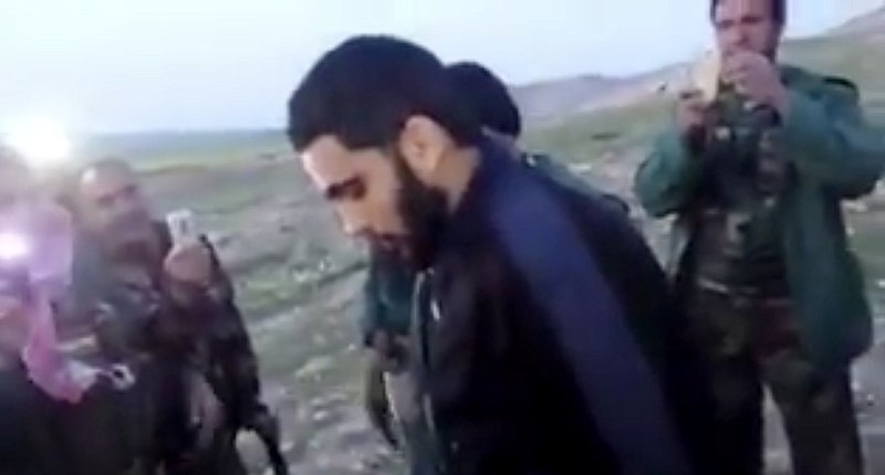 This image made from video posted on Twitter by a Kurdish fighter shows a man that the Kurdish military says is an American member of the Islamic State group shortly after he turned himself in to Kurdish fighters in northern Iraq, Monday, March 14, 2016. The circumstances of the surrender were not fully disclosed but it marked a rare instance in which an IS fighter voluntarily gave himself up to Iraqi or Kurdish forces in Iraq.