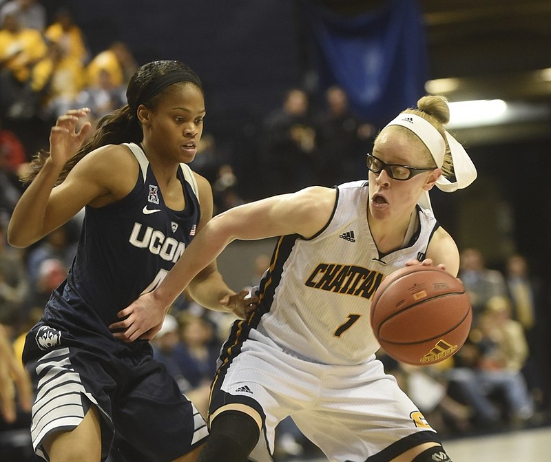 UTC's Alicia Payne is guarded by Connecticut's Moriah Jefferson Monday, November 30, 2015 at McKenzie Arena.