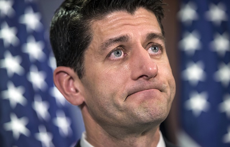 
              Speaker of the House Paul Ryan, R-Wis., talks to reporters following a closed-door caucus meeting at Republican National Committee headquarters on Capitol Hill in Washington, Tuesday, March 15, 2016. Tea party conservatives have blocked a budget plan backed by GOP leaders, a blow to Speaker Ryan and a reflection of the anti-Washington mood pushed by GOP front-runner Donald Trump. The move by the House Freedom Caucus, the same band of conservatives that toppled his predecessor, would mean that the House would fail to pass a budget for the first time since Republicans reclaimed control of the chamber in 2011.(AP Photo/J. Scott Applewhite)
            