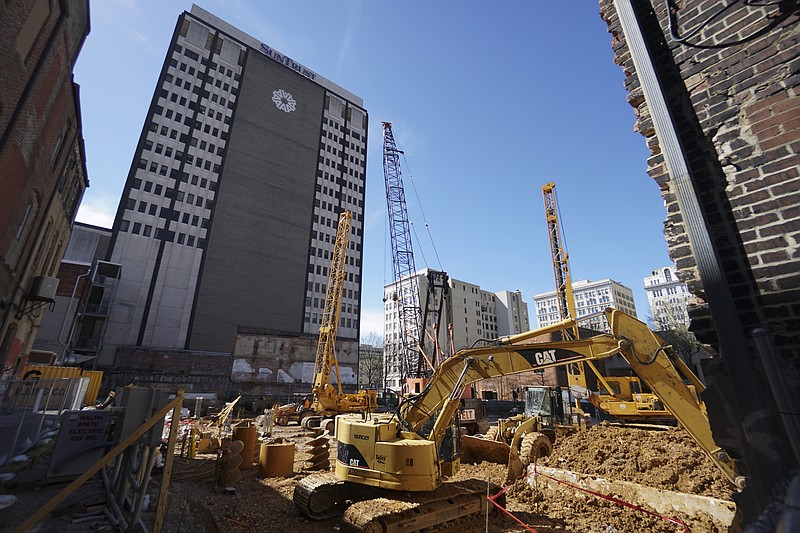 Staff Photo by Dan Henry / The Chattanooga Times Free Press- 2/1/16 Construction continues on a new apartment/commercial building being built on the 700 block of Market Street on Wednesday, March 16, 2016. 