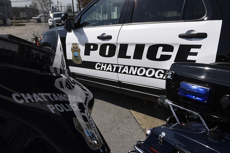 Police motorcycles and a police car are seen before a press conference at the Police Services Center on Wednesday, Mar. 9, 2016, in Chattanooga, Tenn.