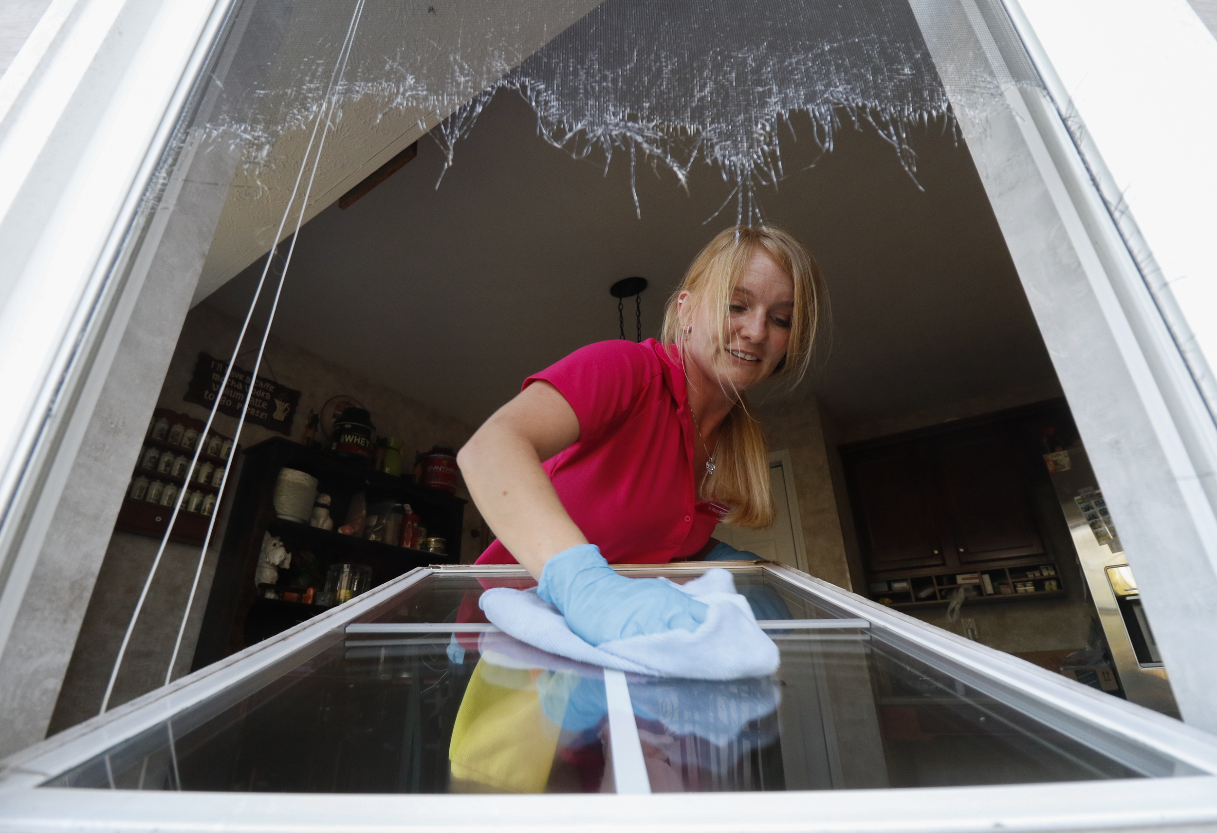 Staff Photo by Dan Henry / The Chattanooga Times Free Press- 3/15/16. Jessica Kittle, 31, with Two Maids and a Mop cleaning service, performs a deep clean on Jacob McDonald's residence on Tuesday, March 15, 2016.