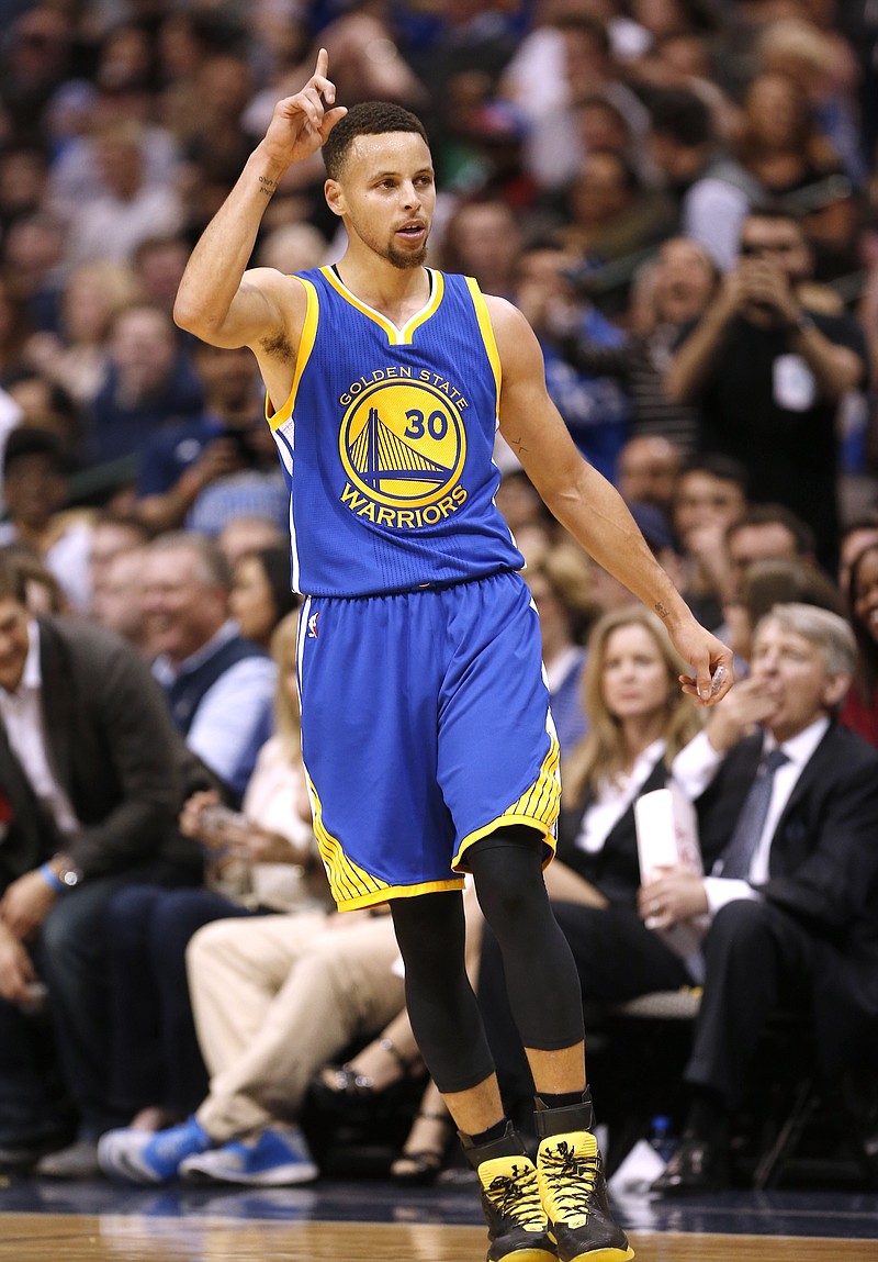 
              Golden State Warriors guard Stephen Curry (30) celebrates a three-point shot during the first half of an NBA basketball game against the Dallas Mavericks Friday, March 18, 2016, in Dallas. (AP Photo/Brandon Wade)
            