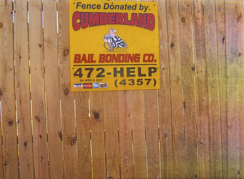 This sign advertising Cumberland Bail Bonds is on a fence donated by the company and placed close to the prisoner entrance of the Bradley County Justice Center. 