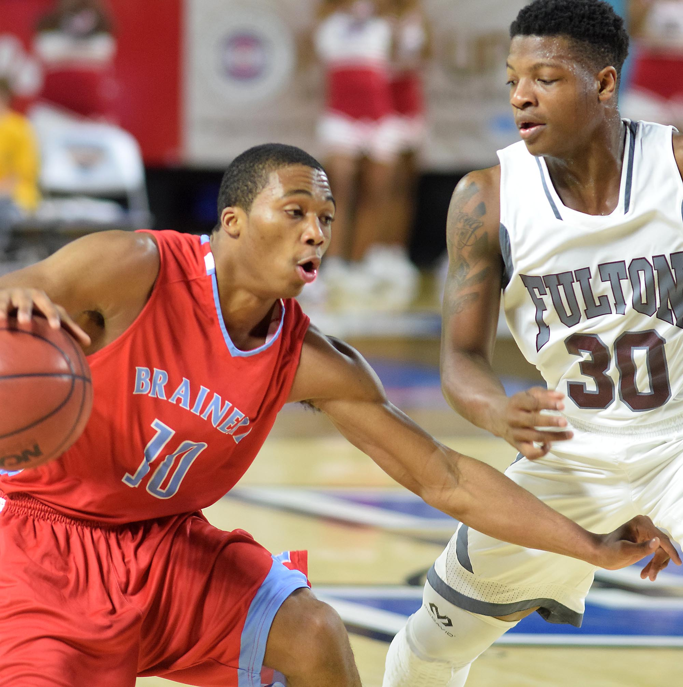 Brainerd's Kentrell Evans (10) looks for room past Futon's Kentel Williams (30). The Brainerd High Panthers faced the Fulton High Falcons in the TSSAA State Division I Class AA Championship at the Murphy Center on the campus of Middle Tennessee State University in Murfreesboro March 19, 2016.