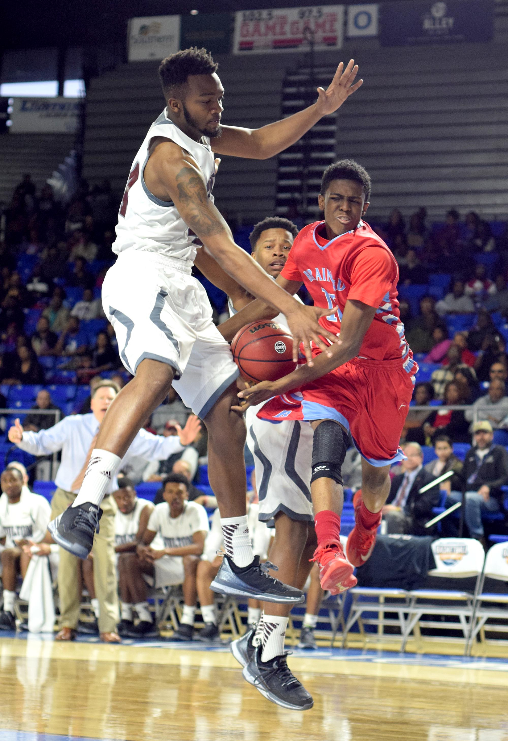 Brainerd's Vesta Melvin (12) has his pass attempt blocked by Fulton's Ron Davis III (24). The Brainerd High Panthers faced the Fulton High Falcons in the TSSAA State Division I Class AA Championship at the Murphy Center on the campus of Middle Tennessee State University in Murfreesboro March 19, 2016.