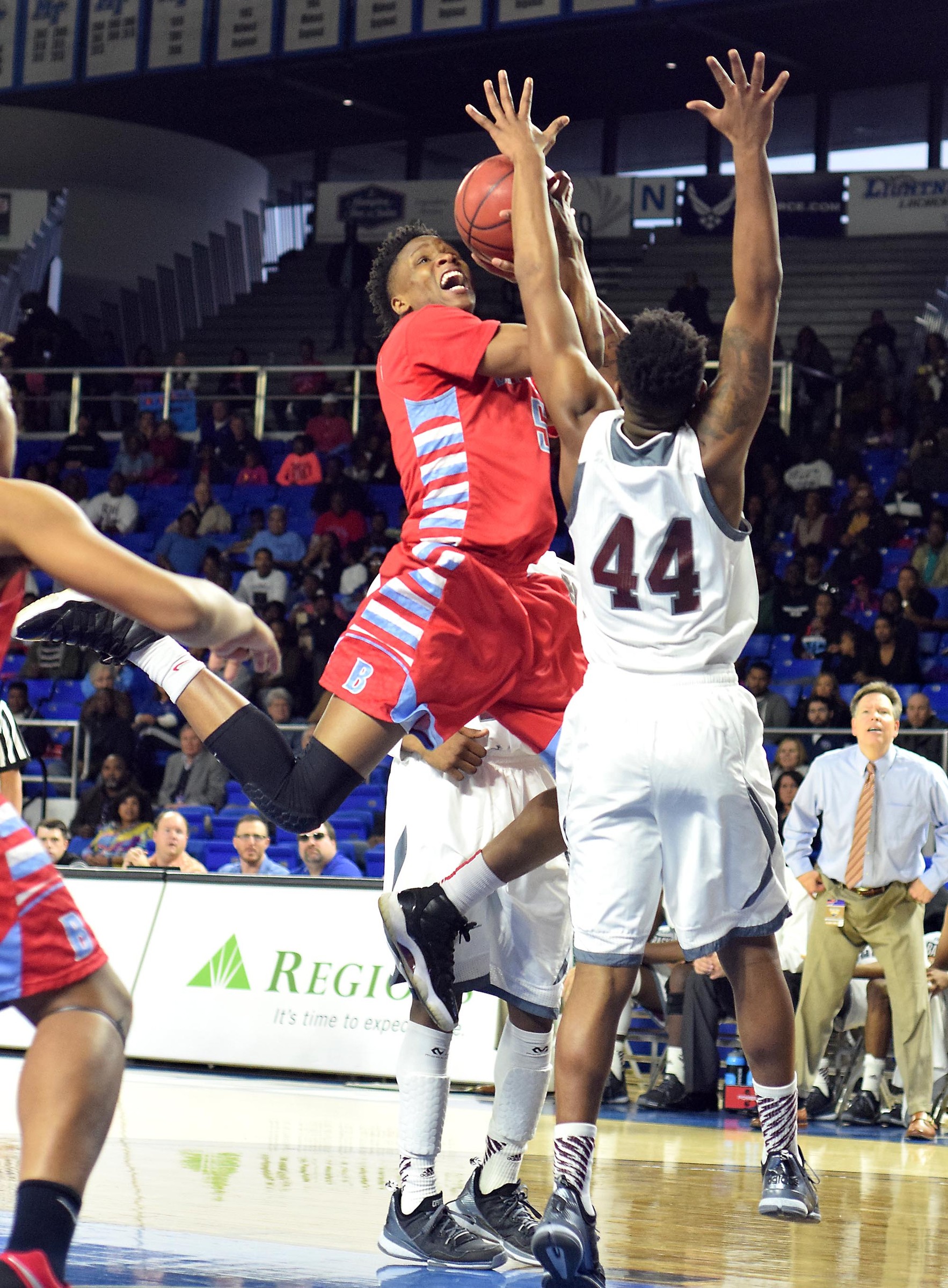 Brainerd's Dajuonta Ross (5) losses control of his shot as Fulton's Joe Kimber (44) defends. The Brainerd High Panthers faced the Fulton High Falcons in the TSSAA State Division I Class AA Championship at the Murphy Center on the campus of Middle Tennessee State University in Murfreesboro March 19, 2016.