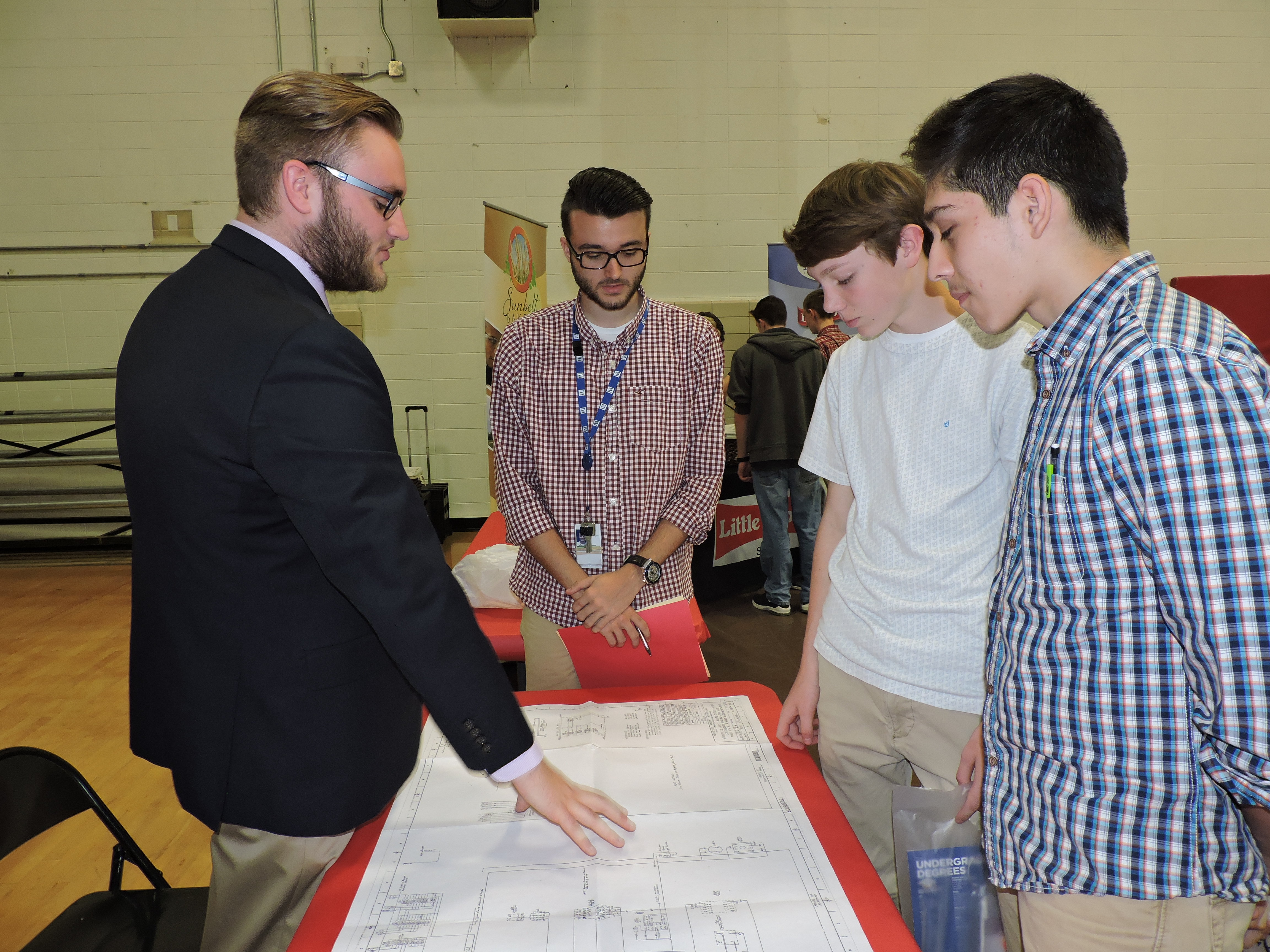 LFO senior Kaelob Flood, CADNET TVA Supervisor Alex Anderson and sophomores Braiden Pack and Emanuel Arroyo take a look at the CADNET program. TVA's CADNET focuses on enrolling LFO juniors and seniors into TVA to help them get their foot in the door for future employment.