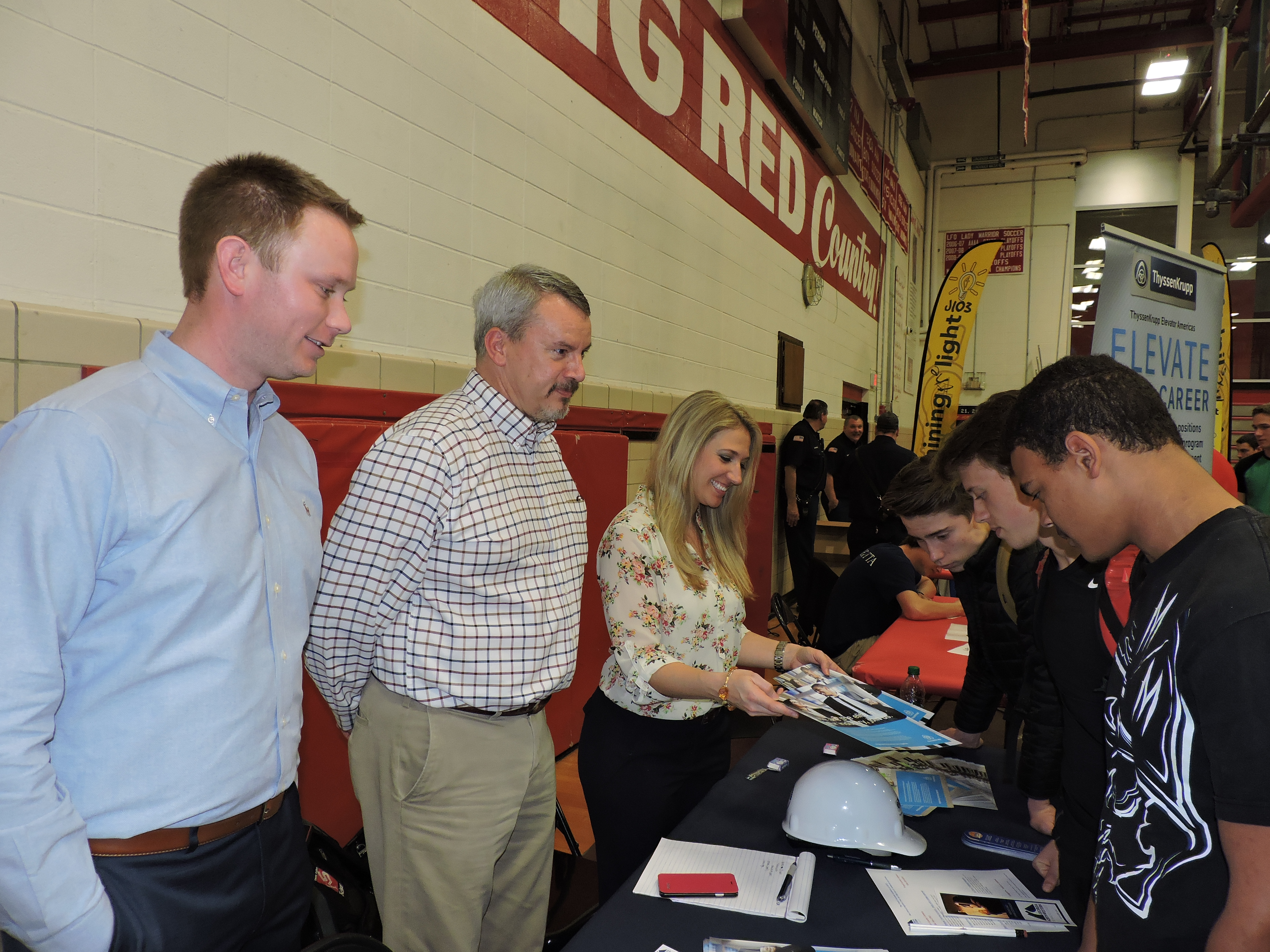Clockwise from left are ThyssenKrupp branch manager Andrew O'Connell, operations manager Rodney Lingerfelt, office manager Erica Ryan, and sophomores Nathan Page, Jarrod Pyle and Avery Saunders.