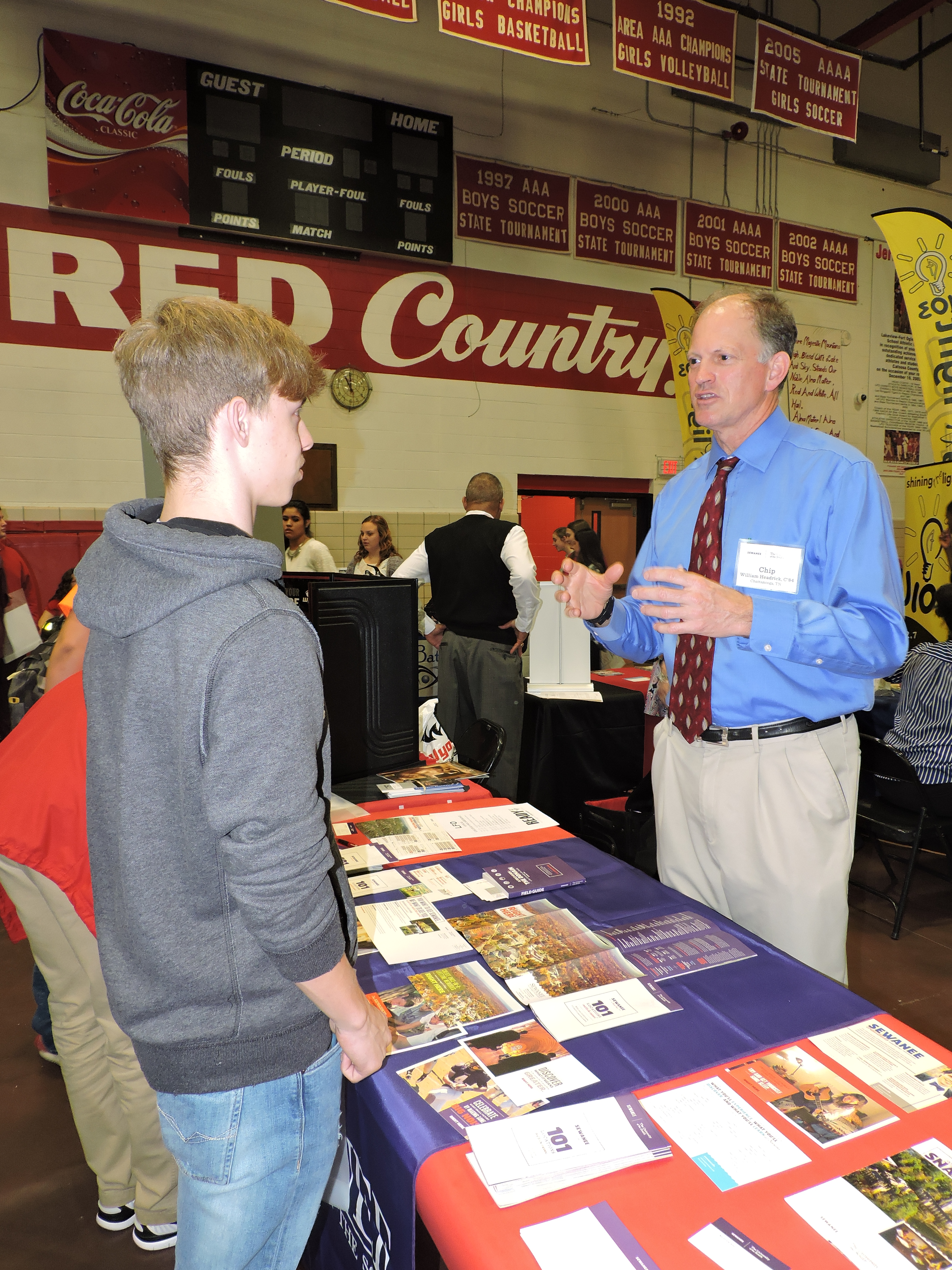 LFO sophomore Chandler Bell, left, talks to Chip Headrick about the Sewanee: The University of the South, where Headrick graduated from in 1984. Bell said he is thinking about attending Sewanee after high school.