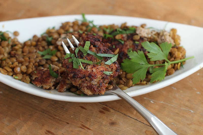 A simple and vinegary lentil salad is the perfect complement to the rich and fatty goodness of sausages.