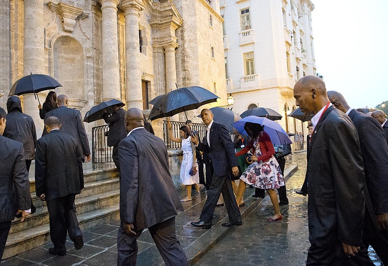 President Barack Obama, center, and first lady Michelle Obama, visit la Catedral de La Habana in Havana, Cuba, Sunday.