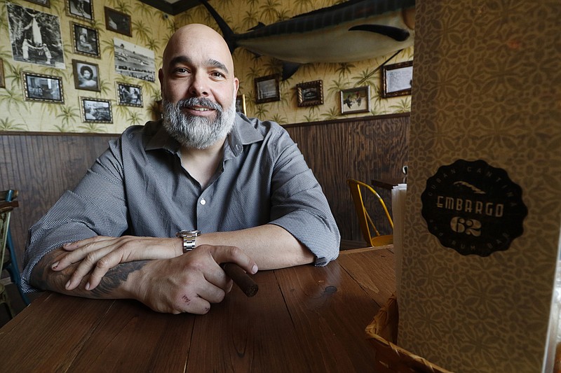 Daniel Alcala, owner of Embargo 62, spends time in his restaurant on Monday.