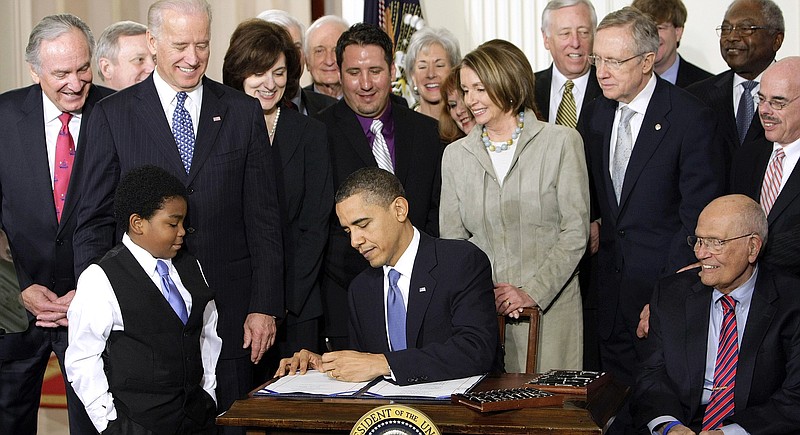 
              FILE - In this March 23, 2010. file photo, President Barack Obama signs the health care bill in the East Room of the White House in Washington. There’s growing evidence that most of the nation’s dramatic jump in health care coverage is due to President Barack Obama’s law, and not the gradual economic recovery. (AP Photo/J. Scott Applewhite, File)
            