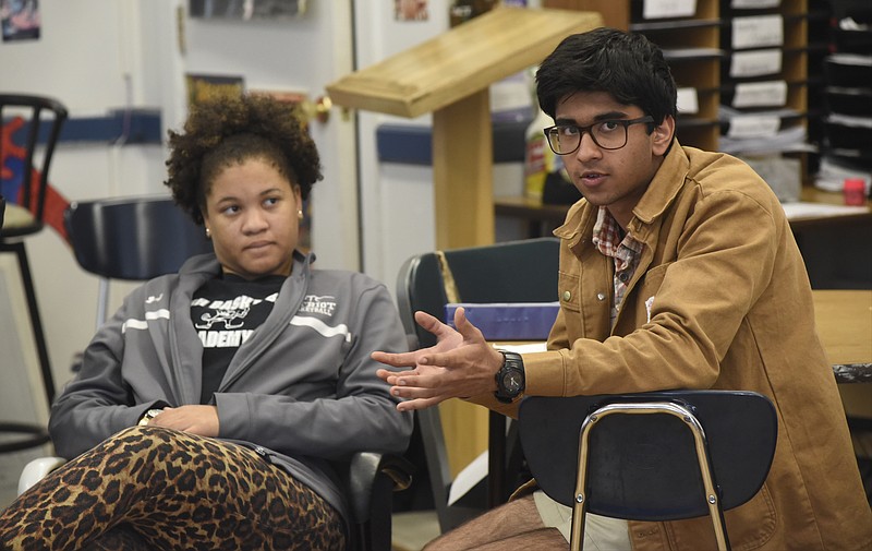 Alma Justice listens as Parth Doshi speaks as Chattanooga School for the Arts and Sciences students discuss Chattanooga 2.0 during their 11th grade seminar class Wednesday, Mar. 23, 2016, in Chattanooga, Tenn. 