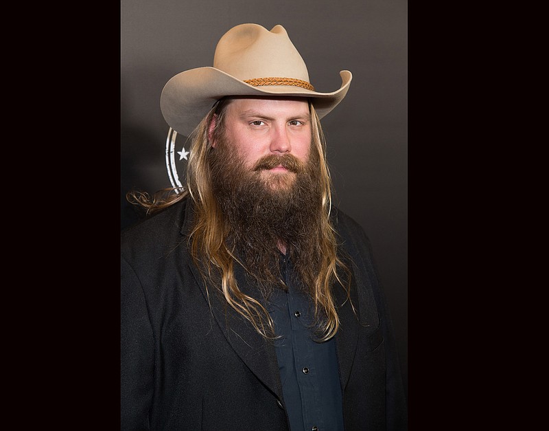
              FILE - In this Dec. 5, 2015 file photo, Chris Stapleton attends the Imagine: John Lennon 75th Birthday Concert at Madison Square Garden in New York. Stapleton was awarded her first award from the Academy of Country Music for new male artist on wednesday, March 23, 2016. The show will air live on CBS on April 3 from Las Vegas. (Photo by Charles Sykes/Invision/AP, File)
            
