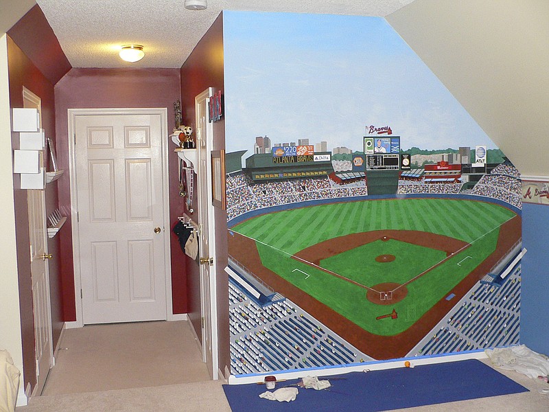 This child's room is decorated in a baseball motif.
