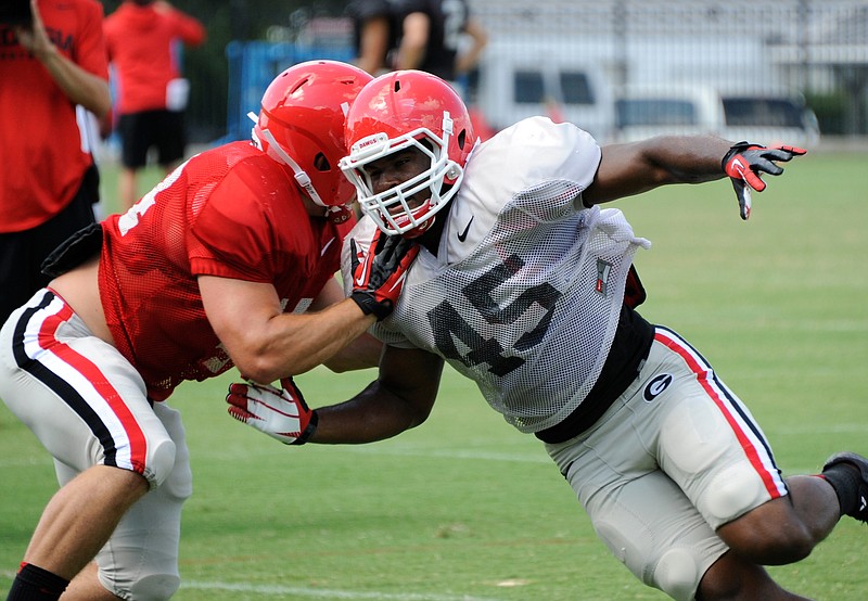 Georgia inside linebacker Reggie Carter is practicing again without limitations after having his 2015 season scratched by shoulder surgery.