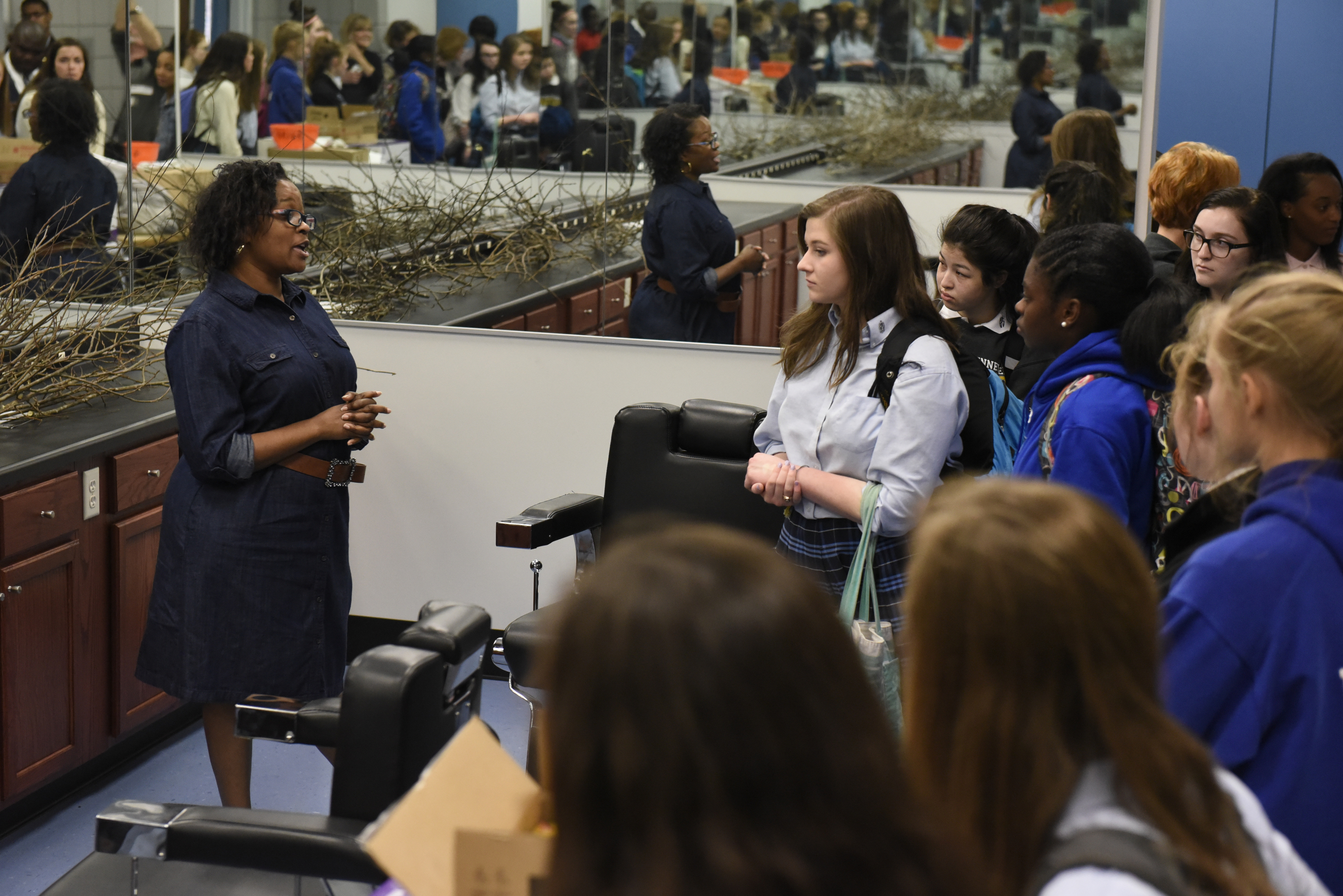 Cosmotology instructor Melinda Williams talks to students from a social justice class at the Girls Preparatory School as they visit Brainerd High School on Thursday, Mar. 24, 2016, in Chattanooga, Tenn.