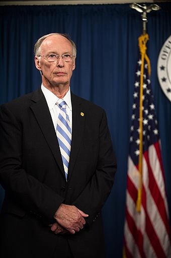 Alabama Gov. Robert Bentley stands during a news conference Wednesday, March 23, 2016, at the state Capitol in Montgomery, Ala. Bentley admitted Wednesday he made inappropriate remarks to a top female staffer two years ago, but he denied accusations that he had a physical affair. Bentley said during the news conference that he apologized to his family and to the family of the female staff member for the remarks he called "a mistake." (Albert Cesare/The Montgomery Advertiser via AP) 