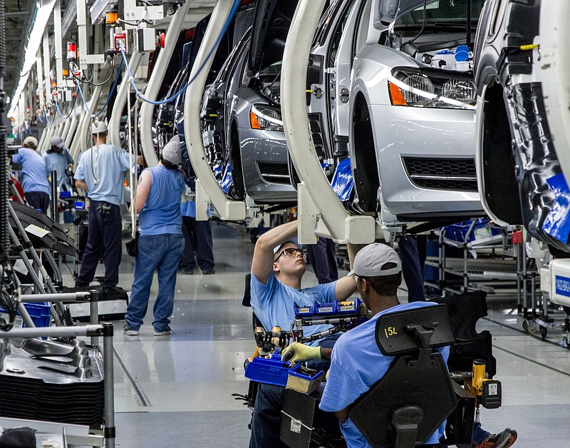 Chattanooga VW workers assemble Volkswagen Passat sedans at the German automaker's plant in this June 12, 2013, photo. (AP Photo/Erik Schelzig)