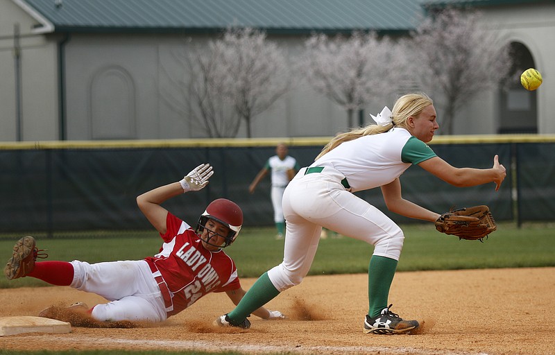 Ooltewah runner Bailey Kennedy is safe at 3rd on a wild throw to Rhea County 3rd baseman Ansley Hill during their Soddy-Daisy Lady Trojans softball tournament silver championship game at Warner Park on Saturday, March 26, 2016, in Chattanooga, Tenn.