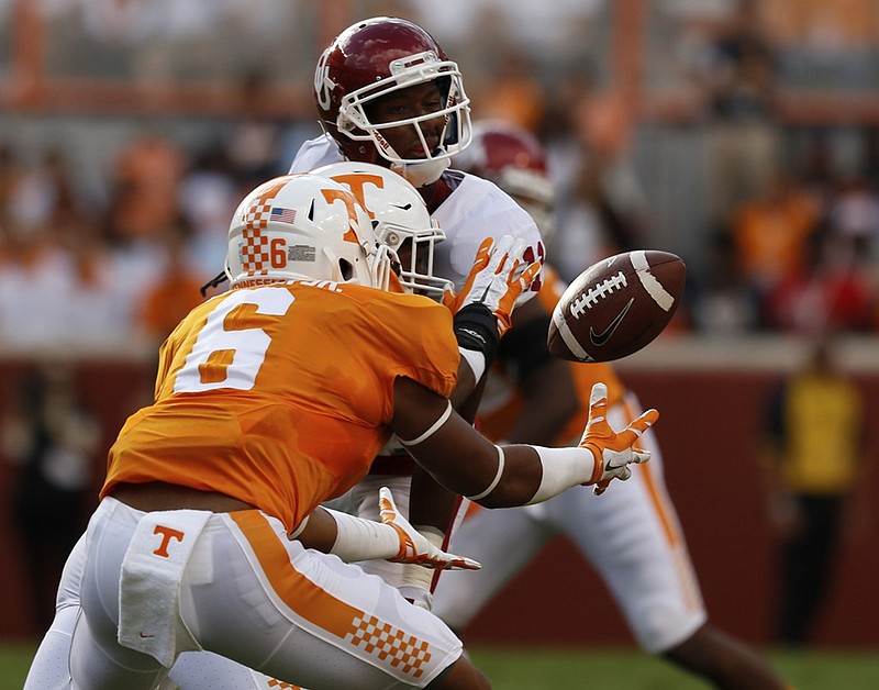 
UT's Todd Kelly Jr. (6) intercepts the ball intended for Oklahoma wide receiver Dede Westbrook (11) during the first half of play Saturday. The Volunteers played the Sooner's at home on September 12, 2015 at Neyland Stadium in Knoxville, Tennessee. 