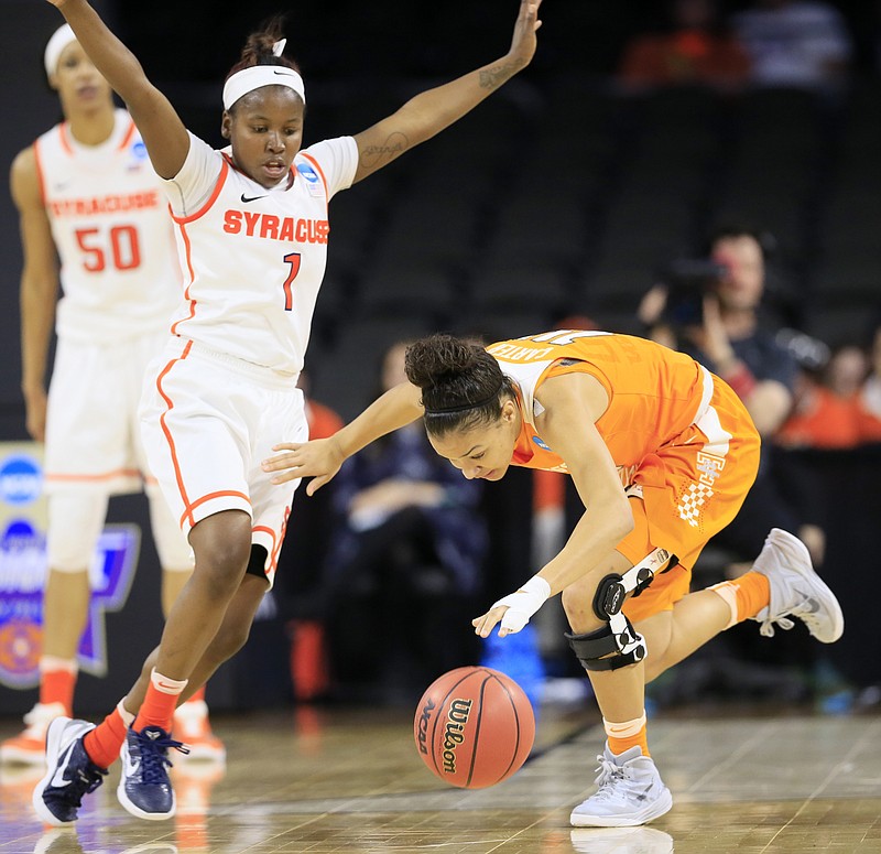 Tennessee guard Andraya Carter, right, runs down a loose ball in front of Syracuse guard Alexis Peterson (1) during the first half of a regional final women's college basketball game in the NCAA Tournament, Sunday, March 27, 2016, in Sioux Falls, S.D. (AP Photo/Charlie Neibergall)