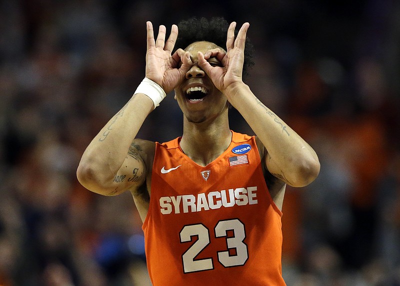 
              Syracuse's Malachi Richardson (23) celebrates after making three point basket during the second half of an NCAA college basketball game against Virginia in the regional finals of the NCAA Tournament, Sunday, March 27, 2016, in Chicago. Syracuse won 68-62. (AP Photo/Nam Y. Huh)
            