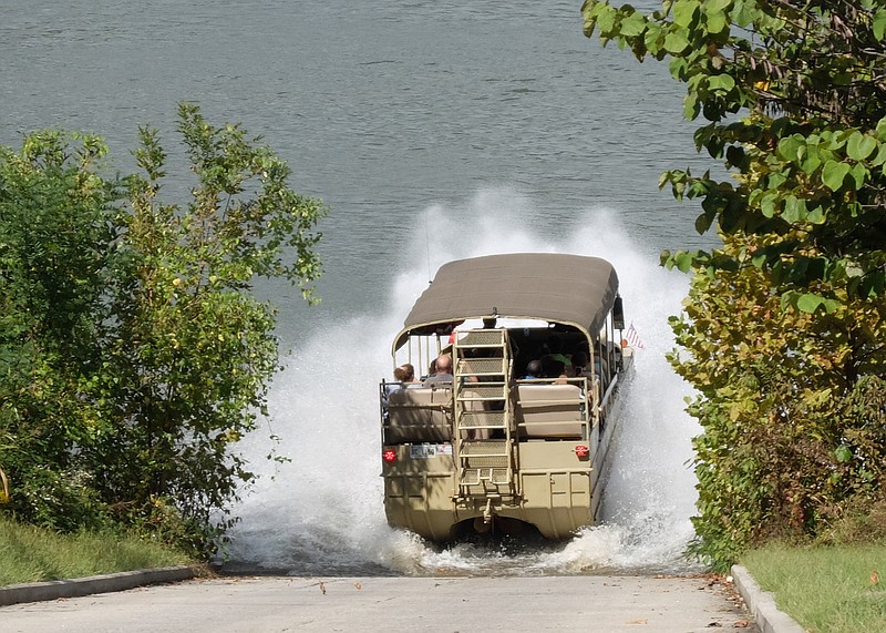 One of the Chattanooga Duck vehicles splashes down into the Tennessee River on a recent tour of downtown. The popular tourist company forewarns riders to brace themselves upon entry.