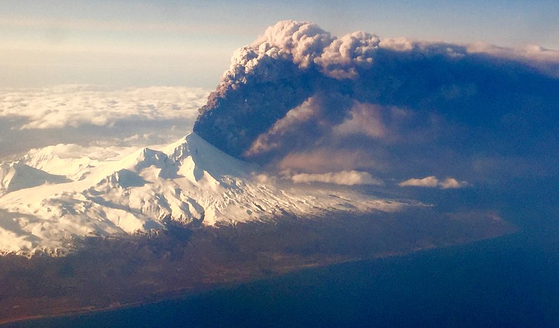 
              In this Sunday, March 27, 2016, photo, Pavlof Volcano, one of Alaska’s most active volcanoes, erupts, sending a plume of volcanic ash into the air. The Alaska Volcano Observatory says activity continued Monday. Pavlof Volcano is 625 miles southwest of Anchorage on the Alaska Peninsula, the finger of land that sticks out from mainland Alaska toward the Aleutian Islands. (Colt Snapp via AP) MANDATORY CREDIT
            