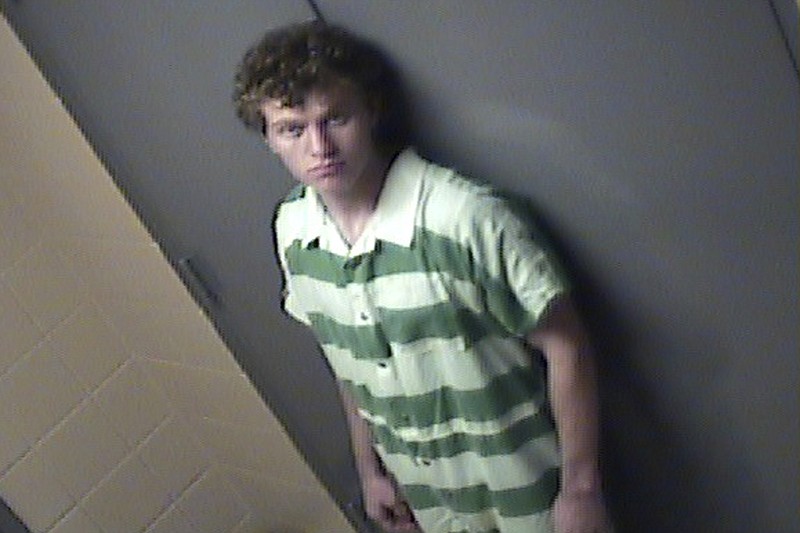 
              File - In this Aug. 7, 2015, file jail photo provided by Conway Ark., Police Department, suspect Hunter Drexler stands by a door in Conway. Drexler, and another teen are charged as adults with two counts of capital murder in the deaths of Robert and Patricia Cogdell. Faulkner County Circuit Judge Troy Braswell granted the request from prosecutors to postpone the trial of Drexler so prosecutors can ask the FBI to help access an iPod and iPhone to search for evidence. (Conway Arkansas Police Department via AP, File)
            