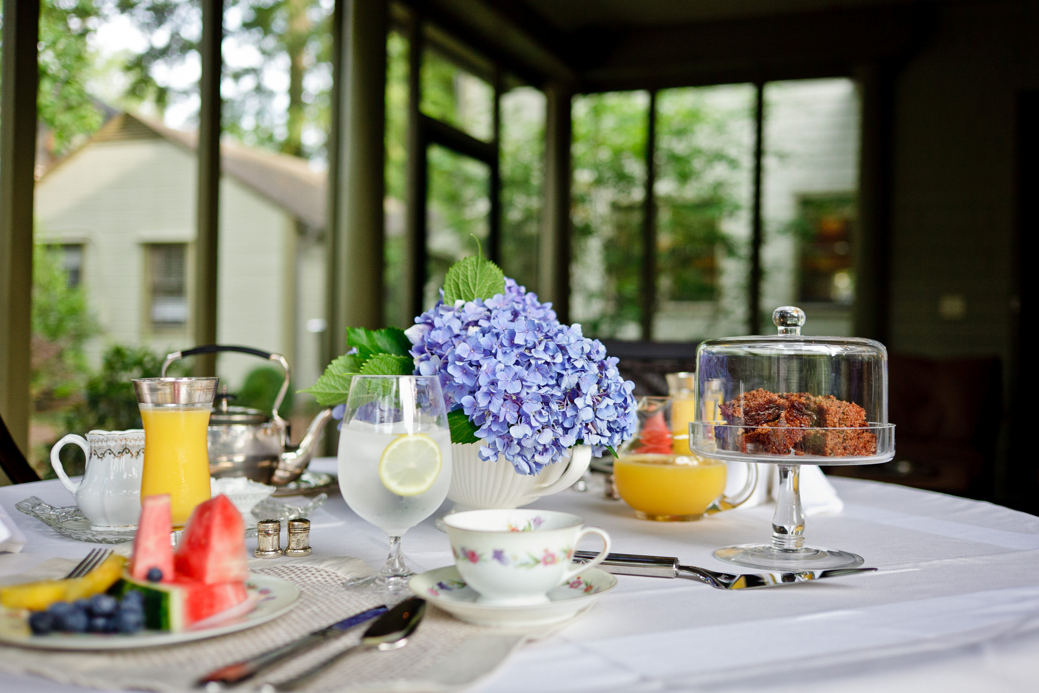 Afternoon tea is served on the screened porch of Stonehurst Place.