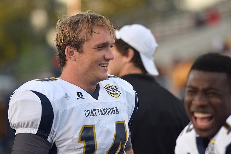 Quarterback Jacob Huesman enjoys a laugh with teammates in the final seconds of UTC's 42-6 victory over Austin Peay.  The UTC Mocs visited the Austin Peay State University Governors in the inaugural game of their new Governors Stadium.