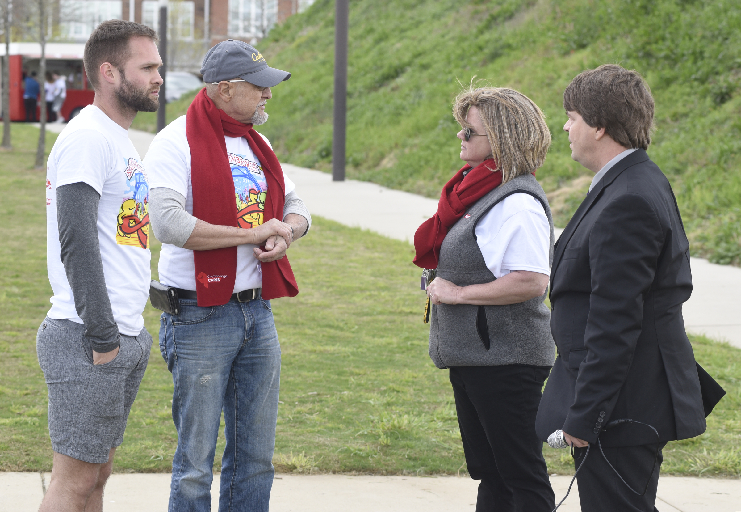 Cory Howard, Marty Townsend, Mitzi Ward and Jason Walker, from left, chat while waiting for the walk to start.