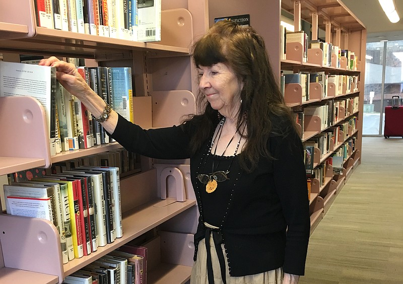 In this photo provided by Adam Allington, taken March 12, 2016, Gloria Adamson, 81, is seen in Boulder, Colo. In the old days, the transition from employment to retirement was marked by a date on a calendar, along with some sheet cake, and a maybe a gold watch. Those days are long gone for most workers in the U.S. Adamson said she never planned to be working this late in life. I simply have to work, retirement isn't even in the picture to tell you the truth, she says. (Adam Allington via AP) 