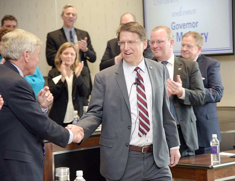 
              FILE - In this Feb. 2016 photo, Gov. Pat McCrory greeted presidents from private and public universities throughout the state at the President's Forum held at Cottrell Hall on the campus of High Point University, in N.C. North Carolina Gov. McCrory signed a new law limiting LGBT protections in his state by overriding local anti-discrimination laws. He faces voters this fall in a re-election effort against the state’s Democratic attorney general.  (Laura Greene/The Enterprise via AP, File) MANDATORY CREDIT (/The Enterprise via AP) MANDATORY CREDIT
            