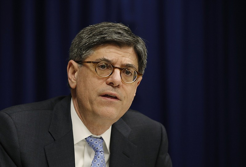 In this March 1, 2016, file photo, U.S. Treasury Secretary Jacob Lew speaks with journalists in Hong Kong. The Obama administration may soon tell governments and banks worldwide they can start using the dollar in some instances to facilitate business with Iran, officials told The Associated Press. In a speech Wednesday, March 30, Lew lauded Iran for accepting the nuclear deal to achieve its goal of ending Western sanctions. (AP Photo/Kin Cheung, File)