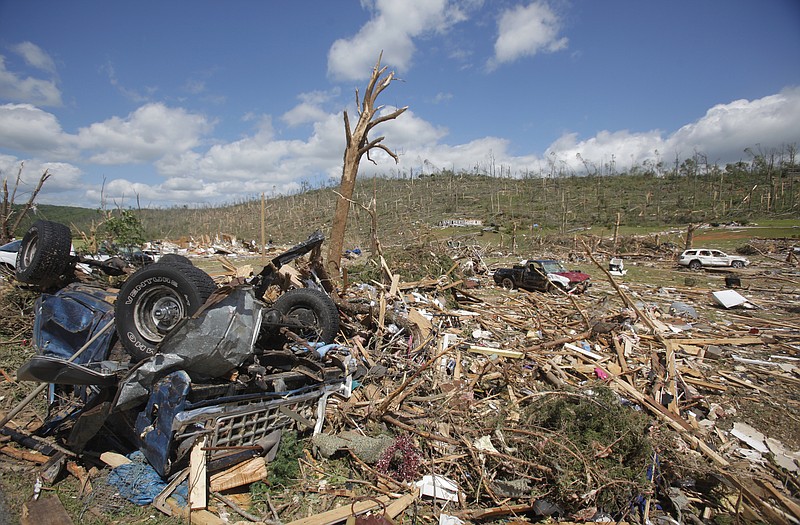 A truck lies overturned next to the pavement in the neighborhood along Cherokee Valley Rd. in Ringgold, Ga., following the April 28, 2011 tornado.